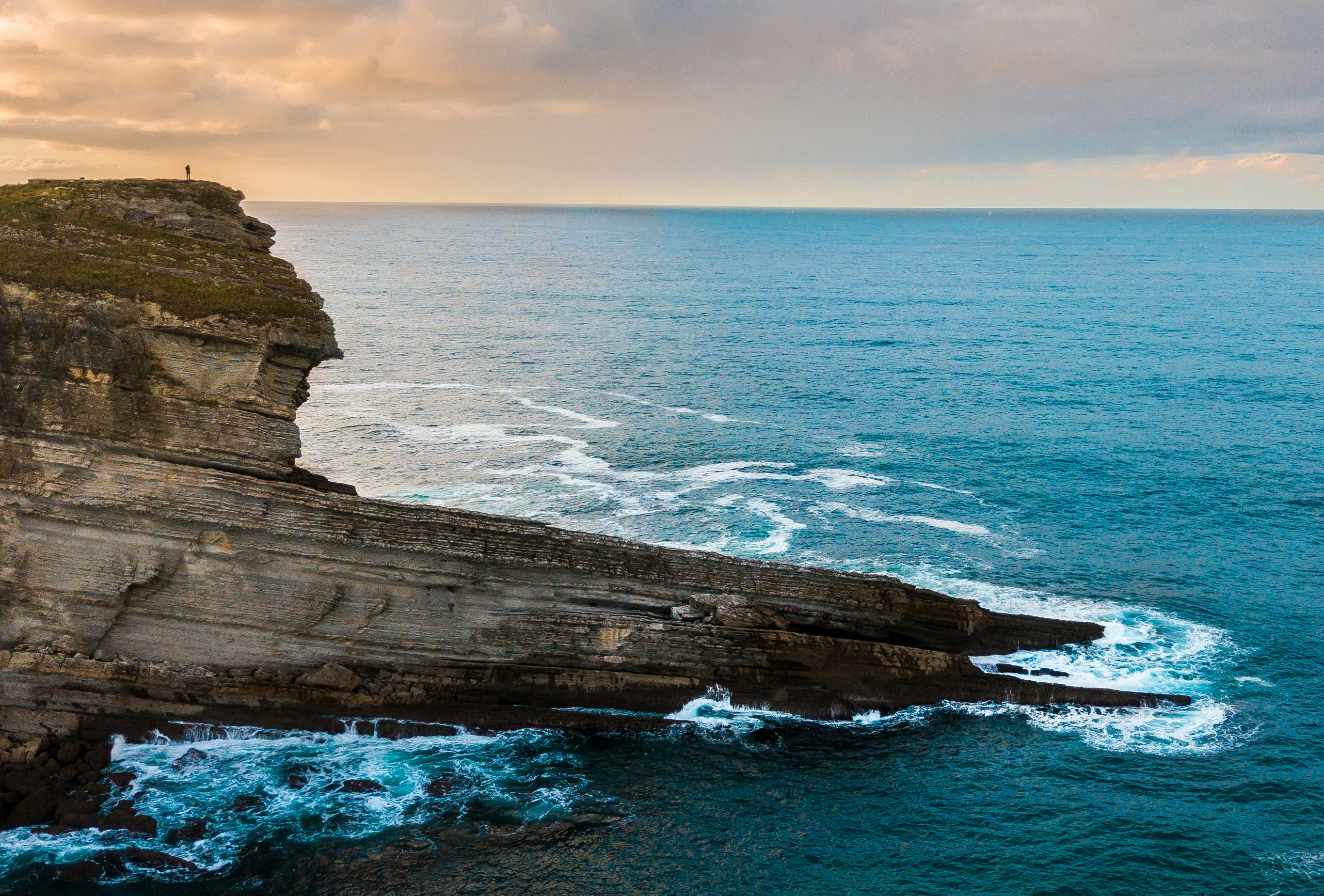 rock monolith beside seashore